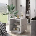 Table d'appoint moderne avec plateau en verre trempé et base de rangement.
